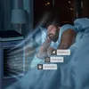A man sleeping in bed next to an air cooler, with feature highlights. Náhled obrázku produktu