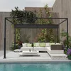 An outdoor patio area with a pergola, sectional sofa, coffee table, and pool. Náhľad obrázku produktu