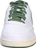 A close-up front view of a white Nike Court Vision Low sneaker with green laces and a green Nike swoosh. Produktbild-Vorschau