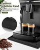 A coffee machine with two cups of espresso, coffee beans, and a drip mat. Produktbild-Vorschau