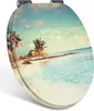 A toilet seat with a tropical beach scene printed on it. Produktbild-Vorschau