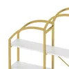 Close-up view of a gold and white shelving unit with arched supports. Produktbild-Vorschau