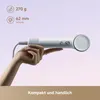 A hand holding a white hairdryer against a gradient background. Produktbild-Vorschau