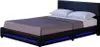 A black upholstered bed frame with blue LED lighting along the base, shown with white pillows and a grey blanket. Produktbild-Vorschau