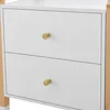 A close-up view of a white dresser with two drawers and gold knobs, set against a white background. Produktbild-Vorschau