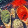 A close-up abstract view of a textured surface with colorful, organic shapes. Anteprima dell’immagine prodotto