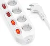 A white power strip with multiple outlets and illuminated switches, along with a white power plug, is shown against a white background. Voir les images du produit