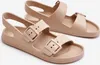 A pair of beige sandals on a white background. Produktbild-Vorschau