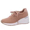 A side view of a single women's sneaker on a white background. Produktbild-Vorschau