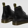 A pair of black Dr. Martens boots shown from the back. Voir les images du produit