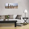 Wallario Premium Leinwandbild Sandstrand mit Holzpfählen am Produktbild-Vorschau 3
