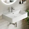 A modern white ceramic wall-mounted sink with a chrome faucet against a tiled wall. Anteprima dell’immagine prodotto