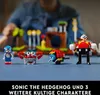 A person is playing with LEGO Sonic the Hedgehog figures and a Green Hill Zone set. Produktbild-Vorschau