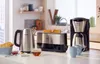 A kitchen counter displaying breakfast appliances and food. Náhľad obrázku produktu