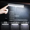 A hand is shown interacting with a light bar mounted inside a dark car interior. The light bar is illuminated, and text overlays describe its modes and brightness settings. Produktbild-Vorschau