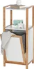 A multi-tiered shelf unit with a built-in laundry basket, made of bamboo and white material, displayed against a white background. Produktbild-Vorschau