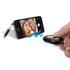 A smartphone is shown with a selfie stick and a remote shutter button. Produktbild-Vorschau