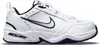 A white Nike Air Monarch IV shoe with navy accents, shown from the side. Produktbild-Vorschau