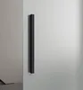 A black handle on a frosted glass sliding door. Produktbild-Vorschau