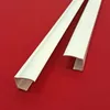 Two white PVC corner profiles are laid diagonally on a red background. Produktbild-Vorschau