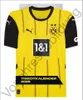 A yellow and black Borussia Dortmund football jersey is displayed front and center against a light gray background. The jersey features the team's crest, sponsor logos, and vertical black stripes. A black banner at the bottom reads "TRIKOTKALENDER 2025". Produktbild-Vorschau