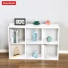 A white modular shelf unit filled with decorative items. Náhled obrázku produktu