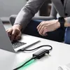 A person is using a laptop and a USB hub connected to it. Náhled obrázku produktu
