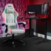 A white gaming chair with RGB lighting is positioned next to a black gaming desk with dual monitors. Produktbild-Vorschau
