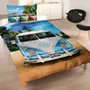 A bed with a VW bus themed duvet cover on a sandy beach. Náhľad obrázku produktu