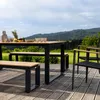 An outdoor dining set on a wooden deck with a scenic mountain view in the background. Náhled obrázku produktu