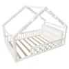 A white house-shaped bed frame with a slatted base and a small shelf at the headboard, decorated with string lights. Produktbild-Vorschau