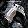 A close-up of a faucet with layers showing its construction, set against a dark, textured background with water effects. Produktbild-Vorschau