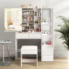 A white vanity table with a large mirror and a stool, filled with various cosmetic products. Produktbild-Vorschau