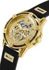 A close-up, angled view of a gold Guess watch with a black band, set against a white background. Podgląd zdjęcia produktu