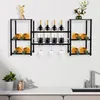 A wall-mounted wine rack with bottles and glasses, displayed above a countertop with a plant and sink. Podgląd zdjęcia produktu