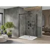 A modern bathroom with a walk-in shower, plants, and vanity. Podgląd zdjęcia produktu