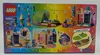 The image shows the back of a LEGO® 41253 Floßabenteuer in Einsamshausen V29 box, displaying various scenes and characters from the toy set. Náhled obrázku produktu
