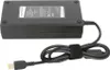 A black laptop power adapter with its cable is shown on a white background. Náhľad obrázku produktu