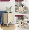A collage showing a folding table in different configurations: folded as a side table, with one leaf extended, and with both leaves extended, set in different room environments. Produktbild-Vorschau