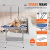 A golden retriever dog is lying on a blue grooming table in a bathroom setting. The image includes text overlays highlighting product features and specifications. Náhled obrázku produktu
