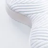 A close-up view of a pillow with a quilted pattern. Produktbild-Vorschau