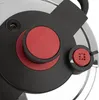A close-up view of the lid of a pressure cooker, focusing on the control knobs and safety valve. Náhľad obrázku produktu