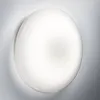 A close-up, studio shot of a white, circular LED ceiling light mounted on a light gray wall. Produktbild-Vorschau