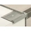 Close-up of a metal stair nosing profile installed on a floor edge. Produktbild-Vorschau