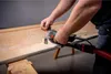A person is using a power tool to sand a wooden surface. Anteprima dell’immagine prodotto