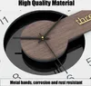 Close-up of a modern wall clock with wooden accents and metal hands. Produktbild-Vorschau