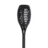 A black solar garden light with a flame effect. Voir les images du produit