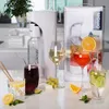 A kitchen counter with a water carbonator, drinks, and garnishes. Podgląd zdjęcia produktu