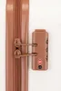 A close-up view of a TSA-approved combination lock and zipper on a piece of luggage. Produktbild-Vorschau