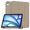 A tan iPad case with a screen displaying a blue and white abstract image, and a stylus resting on the bottom edge of the case. Náhľad obrázku produktu